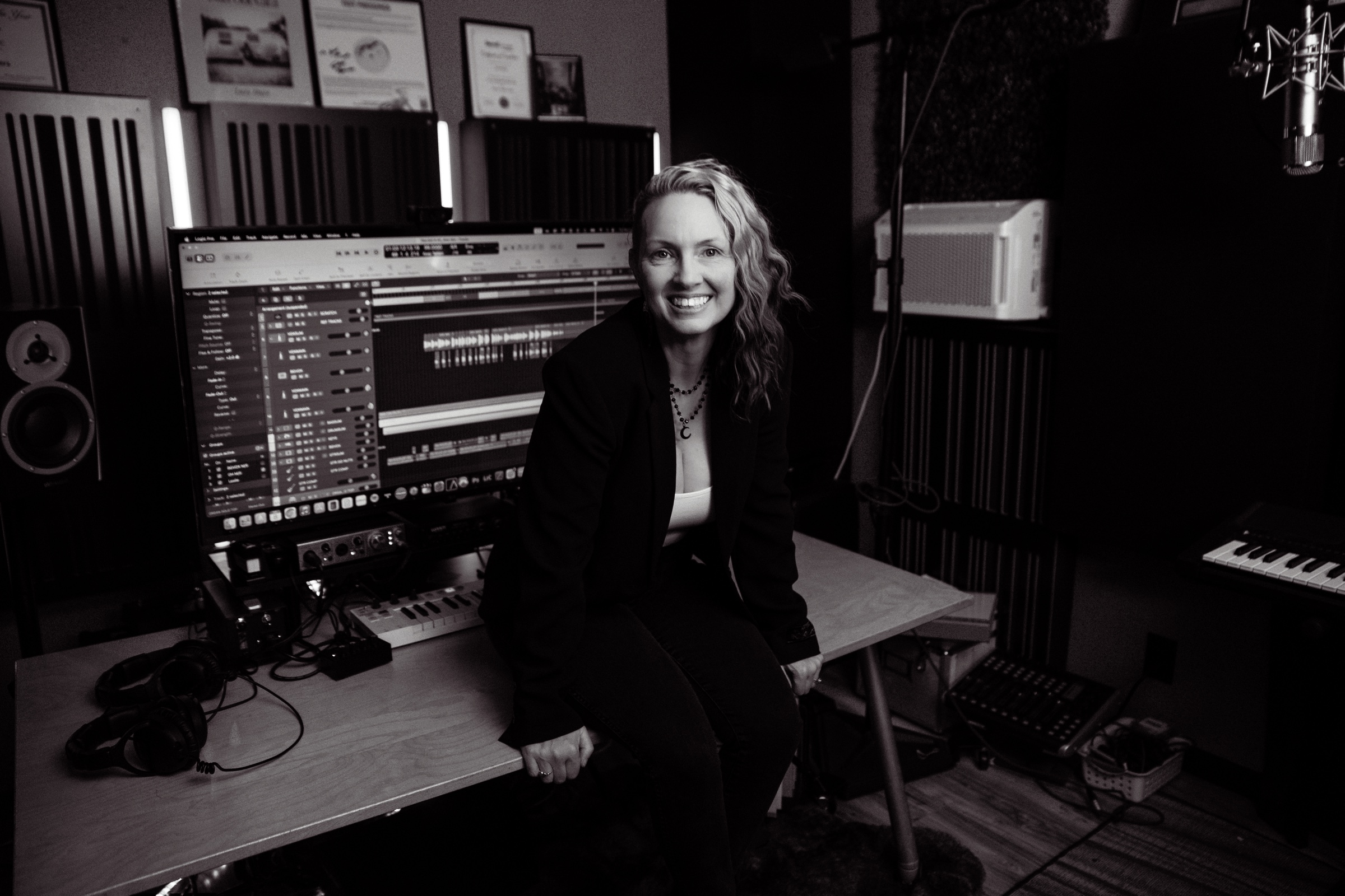 Alex Winters seated at the recording desk in the studio
